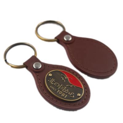 China Custom design brass metal logo metal promotion genuine PU leather key chain key ring for sale