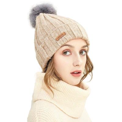 China JOINT New Design Custom Acrylic Winter Warm Knit Hat Solid Color Ribbed Knitted Beanie Hat With Leather Patch for sale