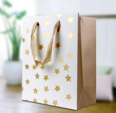 China Recyclable Gold Star Stamped Wedding Favor Gift Paper Bag for sale