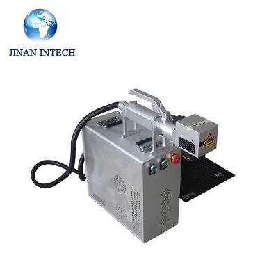 China Air Cooled Handheld Type Fiber Laser Marking Machine For Tire With Raycus Max Ipg Laser Source for sale