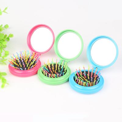 China Rainbow Hair Comb Foldable Wholesale Plastic Pocket Portable Round Brush With Mirror for sale