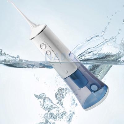 China Outdoor Professional Factory Manual Water Flosser Jet Dental Care Oral Irrigator with Rotating Tips for sale