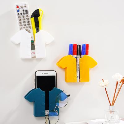 China Modern New Style Multiple Colors Adhesive Wall Mount Phone Wall Charger Holder Storage Box Cell Phone Holder for sale