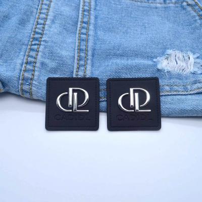 China Custom best price brand jeans clothing label waterproof PU label embossed / metal label leather patch for clothes garment for sale