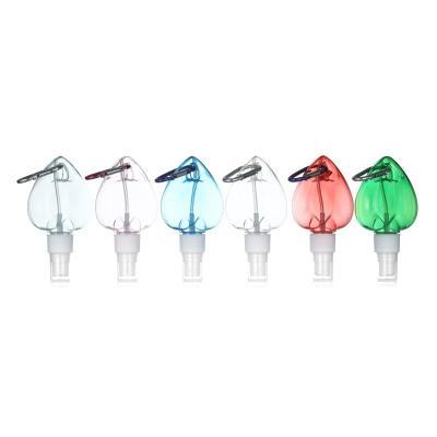 China Non Spill Wholesale 50ml 60ml 100ml Unique Heart Shape Plastic Spray Bottle With Metal Key Chain for sale