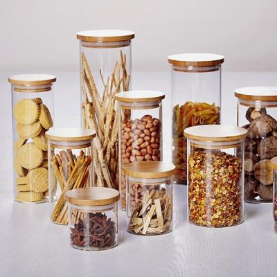 China Hot Selling Round Glass Freshness Food Storage Jars With Lids /pantry Bamboo Storage Containers Set Kitchen Glass Canisters for sale