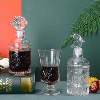 China Wine Carving Glass Bottle With Unique Design Round Cork Fish Shape For Wine Glass Bottle for sale