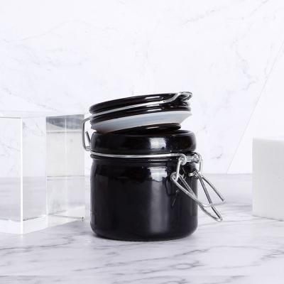 China Opaque Airtight Black Glass Herb Storage Jar Canned Food Mocale Light Proof 50g Glass Jar UV Protection With Swing Top for sale