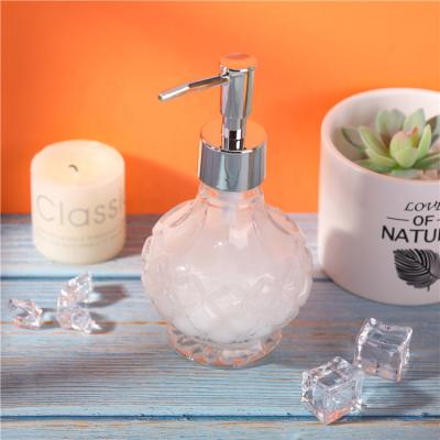 China Personal Care Custom Ball Shape 220ml Transparent Empty Luxury Glass Lotion Bottles For Liquid Soap With Pump Spray for sale