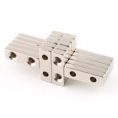 China Industrial Magnet Neodymium N52 50x20x10 Countersunk Block Magnet Hole for sale