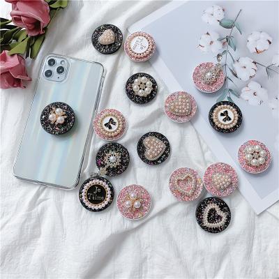 China Universal Ring Phone Holder Accessories With Adjustable Luxurious Pearl Sparkle Phone Holder Stand Adjustable Height for sale