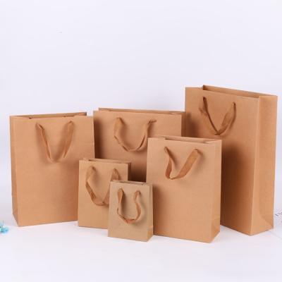 China Different Types Of Recyclable Wholesale Custom Brown Kraft Paper Gift Bag Printing Logo for sale