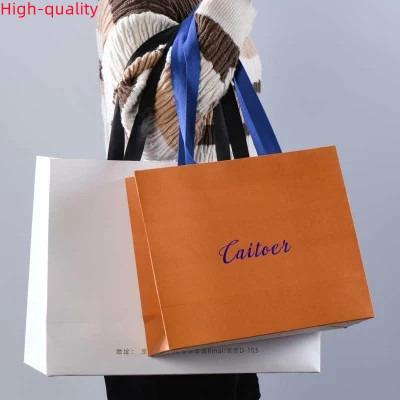 China Custom Recyclable Your Own Logo Printed Recyclable Luxury Paper Bags Packaging Clothing Kraft Paper Shopping Bag With Black Ribbon Handle for sale