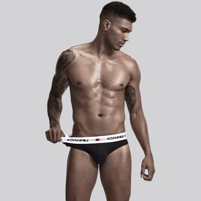 China Anti-Static Mens Solid Color Underwear Hip Waist Youth Lifting Triangle Low Tops Sexy Cotton Shorts For Men for sale