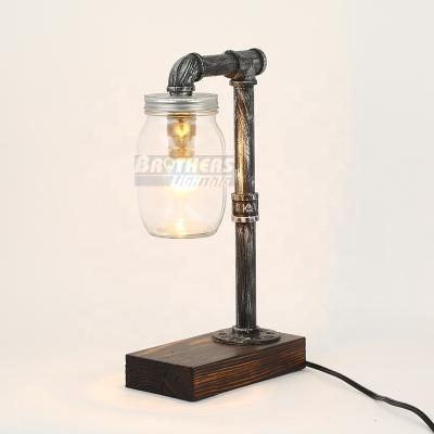 China Modern Industrial Vintage Desk Lamp Pipe Table Lamp Industrial Lighting Attic Table Lamp With Glass Bottle for sale