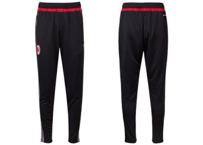 China El fútbol tailandés negro de la calidad de AC Milan jadea los pantalones 100% del poliéster de los pantalones largos en venta