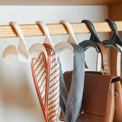 China Durable Wardrobe Bag Bag Hook Rack Arched Universal Hanging Belt Handbag Bag Hanger Tie Scarf Buckle Wardrobe Storage Rack for sale