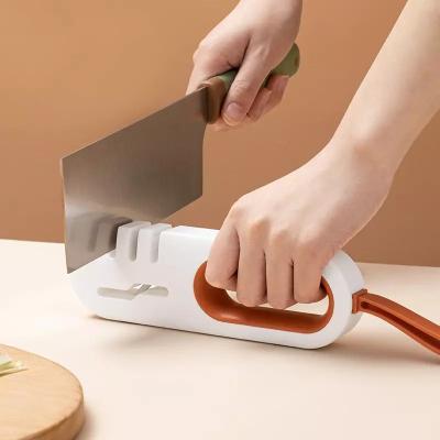 China Multifunctional Disposable Four-in-One Knife Sharpener Kitchen Household Knife Scissors Sharpening New Artifact Fast Manual Knife Sharpener for sale