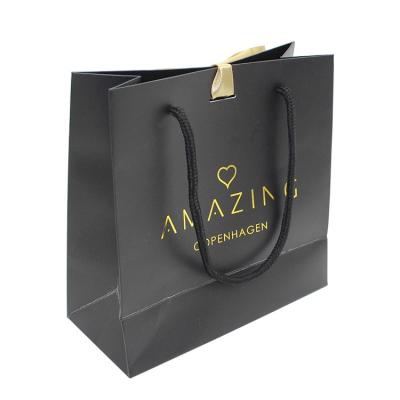 China Reused Materials Logo Matte Black Print Custom Shopping Clothing Packaging Cheap Wholesale Gift Jewelry Paper Bag With Ribbon for sale