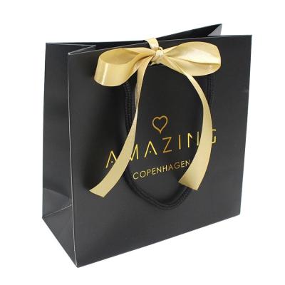 China Custom Materials Fashion Recycled Logo Print Cosmetics Luxury Gift Wig Shopping Packaging Paper Bags for sale