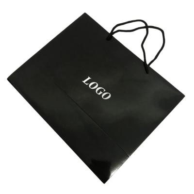 China Recycled materials good quality luxury custom design luster black paper bag gift paper bag luxury shopping hadle rope for sale