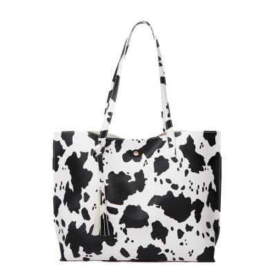 China Large Capacity Soft Tassel Leather Cow Printing Womens Shopping Handbags Faux Cross - Shoulder Foldable Tote Body Tote Bag for sale