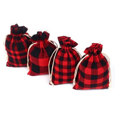 China Christmas Cotton Drawstring Plaid Storage Bag Recyclable High End Custom Sack Red And Black Washable Bag For Xmas Party Favor for sale