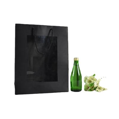 China Recyclable Hot Sales Black Paper Bag With Engraving And Clear PVC Window For Packing Gifts for sale