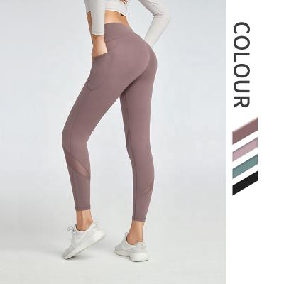 China Mesh Breathable Gym Clothes Women Breathable Legging With Pocket Sports Fitness Wear Workout Yoga Pants for sale