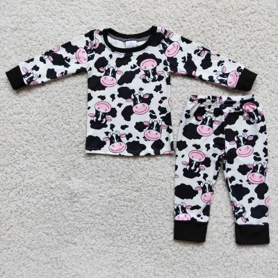 China Winter Cow Soft Cute Pattern Pajamas Black Long Sleeves Boy/Girl Milk Silk High Quality Kids Clothes for sale