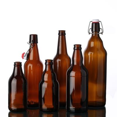 China Homemade 500ml Amber Glass Beer Bottles 16 Ounce Drink with Flip Swing Top Caps for sale