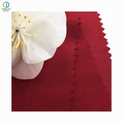 China 230T Wine Red Shrink-Resistant 100%Recycled Peach Polyester Flat Taffeta Fabric For Bags Lining for sale