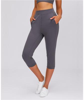 China 2021 New Design Breathable Outer Pants Wear With Pocket Casual High Waist Breathable Hip Stretch Slim Yoga Pocket Sports Pants for sale