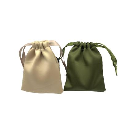 China Luxury High Quality Small Stain Pouch Drawstring Bag Drawstring Eyelashes OEM Cloth Fabric Dust Cosmetic Packaging Pouch for sale