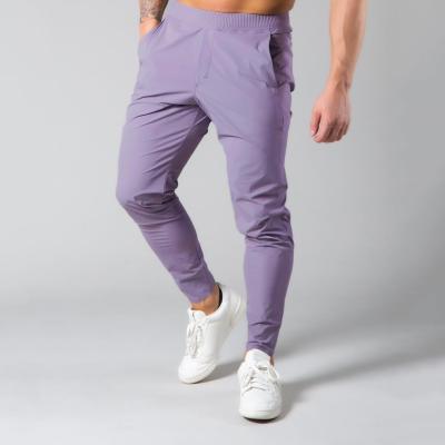 China Wholesale Anti-Static Side Pockets Solid Color Pants Gym Pants Men Quick Dry Sweat-Wicking Workout Pants Mens Hip Hop Jogger Pants for sale