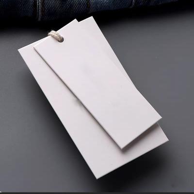 China Recyled Custom Free Design Printing Name Logo Brand Tags Kraft Paper Tags Clothing Hang Tags With White Black String for sale