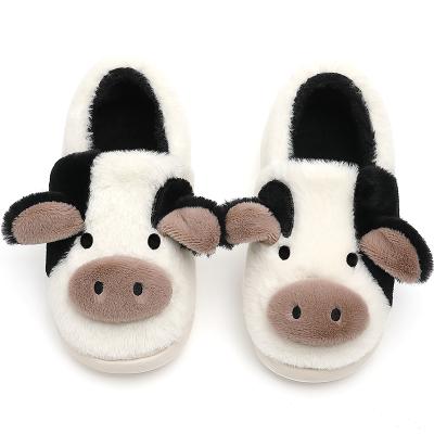 China Fashion Trend Fashion Cow Animal Shape Black And White Indoor Shoes Milky Day Winter Cold Keep Feet Fuzzy Slippers For Adults Warm for sale