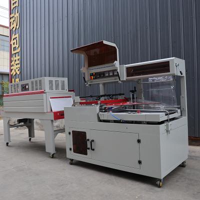 China 1.35KW Box Shrink Wrap Machine 220V / 380V Shrink Wrapper For Food And Beverage for sale