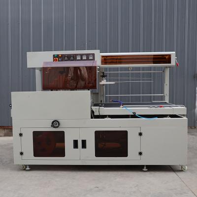 China Verpakkingsmachine met warmteverminderende plastic film, volledig automatisch, op maat Te koop