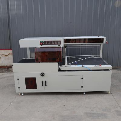 China Op maat gemaakte automatische plastic wrap sealer machine POF / PE film krimpen wrap machine Te koop