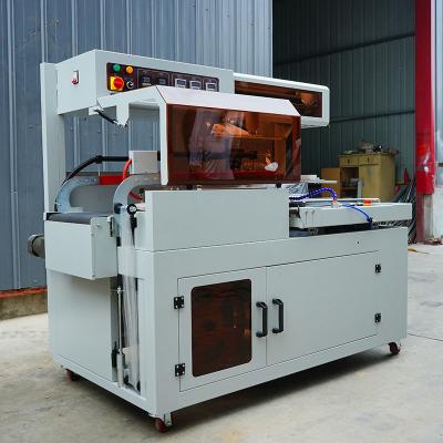 China 0.03-0.25mm Film Thickness Fully Automatic Shrink Wrapping Machine PLC Control System for sale