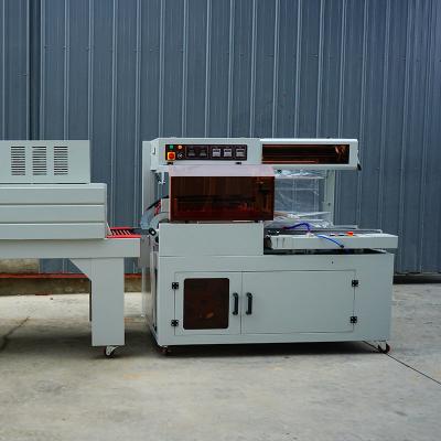 China Fully Automatic Shrink Wrapping Machine For Standard Size 220V/50Hz Power Supply for sale