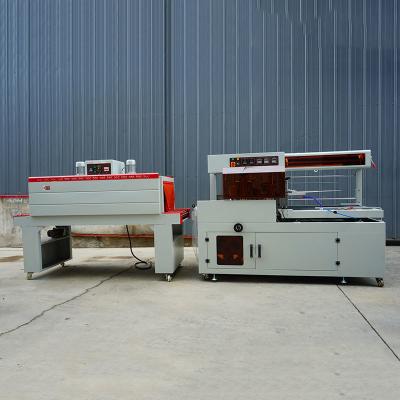 China Stainless Steel PLC Controlled Fully Automatic Shrink Wrapping Machine 220V/50Hz Power Supply for sale