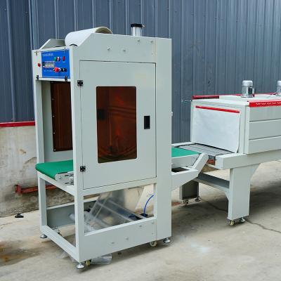 China Stainless Steel Cuff Style Packaging Machine For Food Clothing Toys Daily Chemicals PLC Control System 2KW for sale