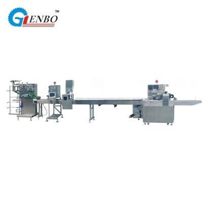 China New Product Design High Quality Napkin Disposable Cutlery Packing Machine With Rotary Feeder for sale