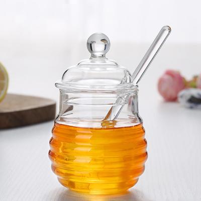 China Viable Glass Honey Container Glass Honey Jar With Thick Lid And Drip Device Glass Honey Jar For Home Use for sale