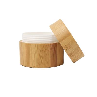 China 30g 80g wide lipped frosted stackable bamboo jar 2oz 30g 80g no plastic eco jar bamboo glass bottle set for sale