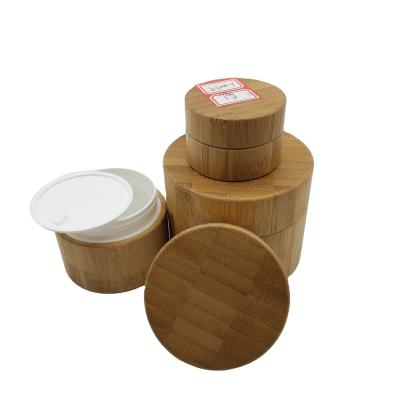 China 100ml 200ml 250ml 500ml 1000ml cosmetic cosmetic packaging customized bamboo cosmetic plastic bamboo bottle jar packaging container for sale