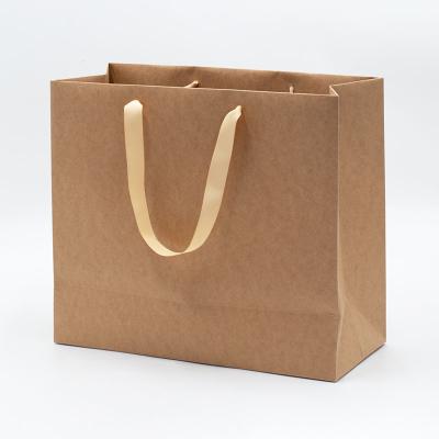 China 50pcs Eco - Friendly Recycled Bulk Paper Shopping Bags Packaging Materials Custom Logo for sale