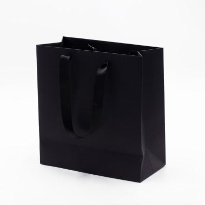 China Hot-sale luxury recycled materials custom made your logo with black and design logo paper gift bags for shopping for sale